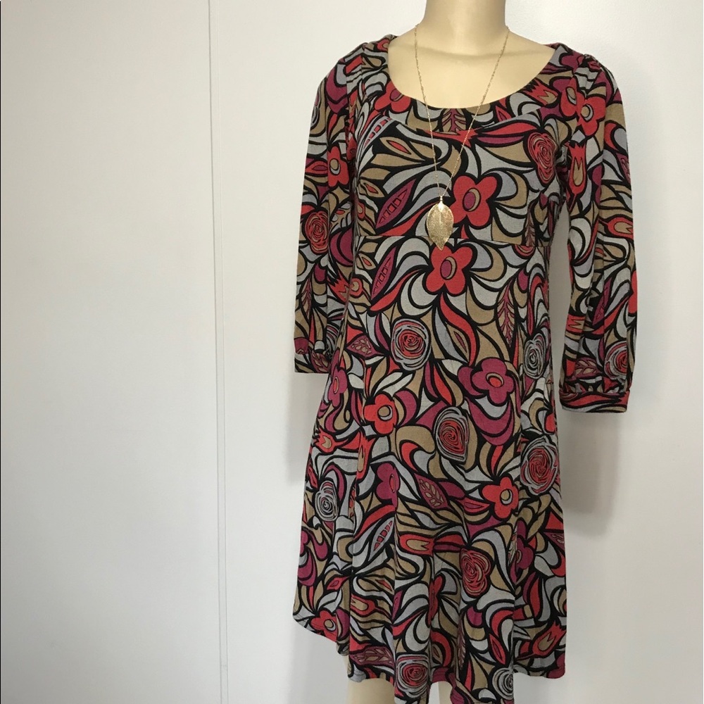 TianaB short baby doll dress with a floral pattern